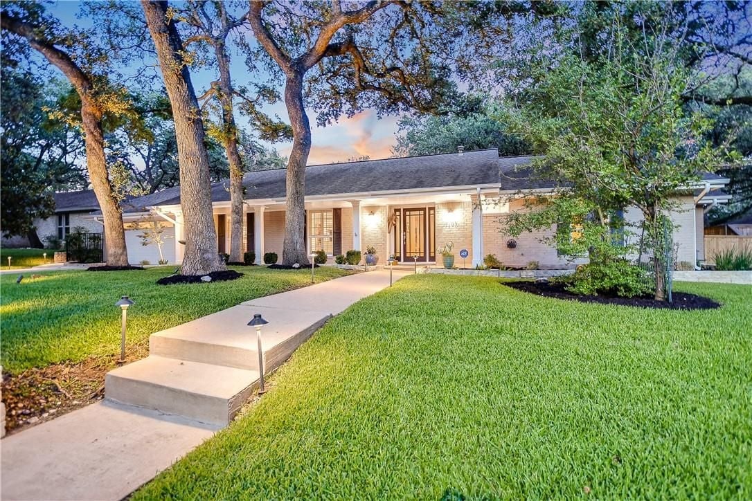 View 7703 Ridgestone Dr in Northwest Hills Northwest Oaks 7703 Ridgestone Dr - front exterior - Luxury home in Northwest Hills Northwest Oaks, Austin, TX