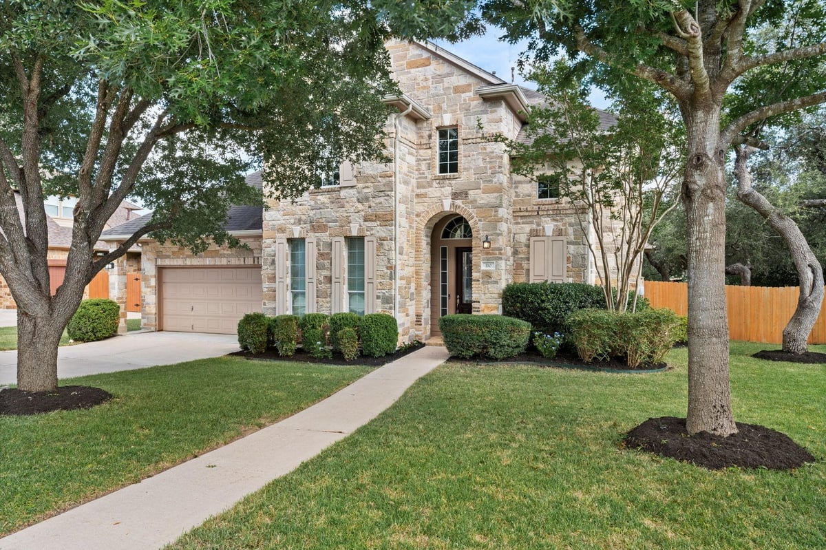 View 110 Monarch Ln in Belterra Ph 01 Sec 06a 110 Monarch Ln - front exterior - Luxury home in Belterra Ph 01 Sec 06a, Austin, TX
