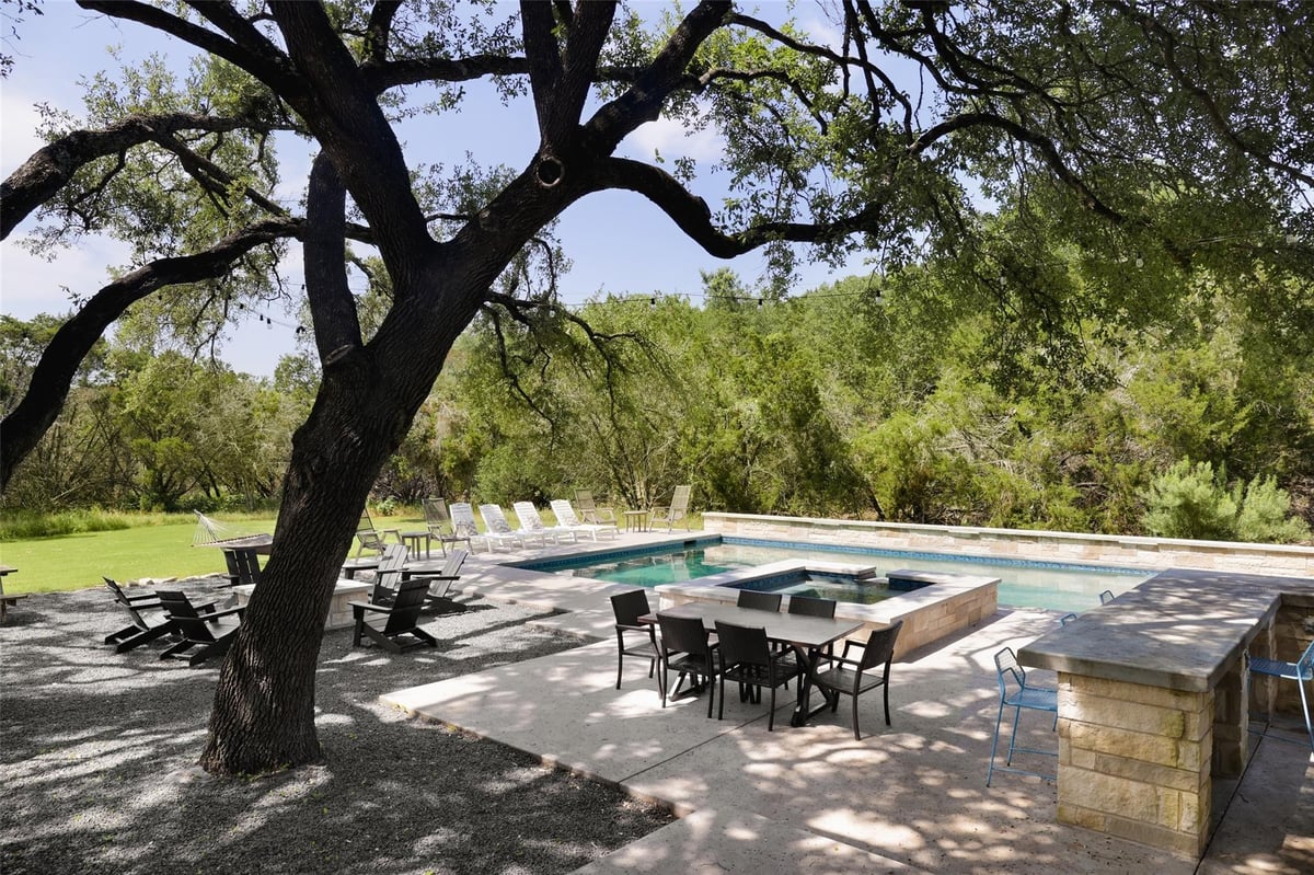 View 11505 Southwest Oaks in Oak Run Estates 11505 Southwest Oaks - patio with outdoor dining terrace - Luxury home in Oak Run Estates, Austin, TX