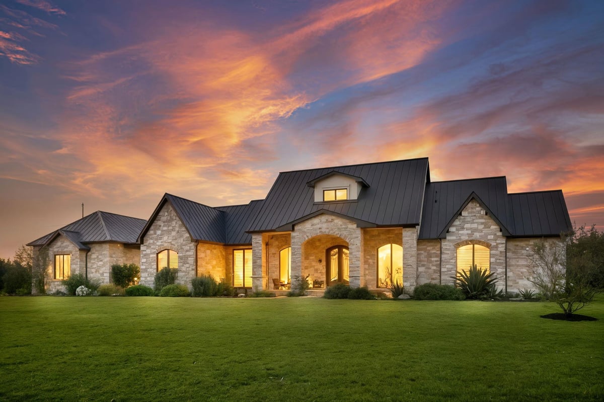 View 11601 Morningsun DR in Sunrise Country 11601 Morningsun DR - front exterior with twilight luxury facade and arched entry - Luxury home in Sunrise Country, Austin...