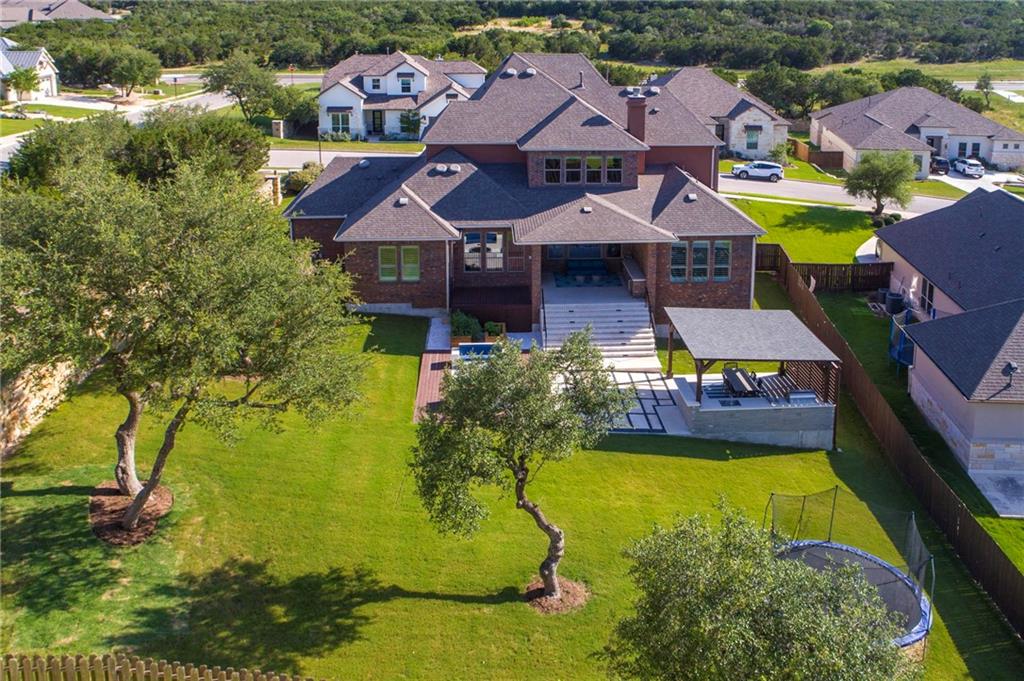 View 124 Drennan Ln in Belterra Ph 4 Sec 19b 124 Drennan Ln - front exterior - Luxury home in Belterra Ph 4 Sec 19b, Austin, TX