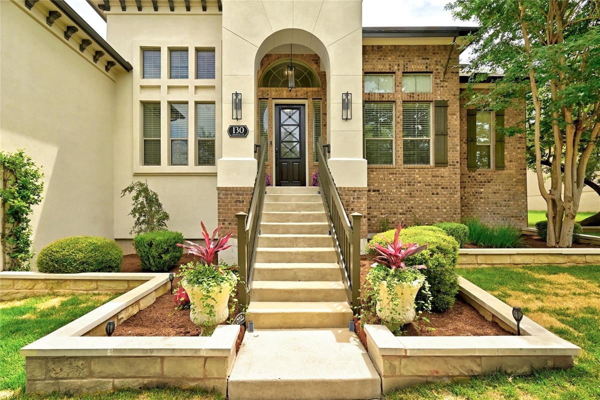 View 130 Granite LN in Belterra Ph 2 Sec 5D 130 Granite LN - front exterior - Luxury home in Belterra Ph 2 Sec 5D, Austin, TX