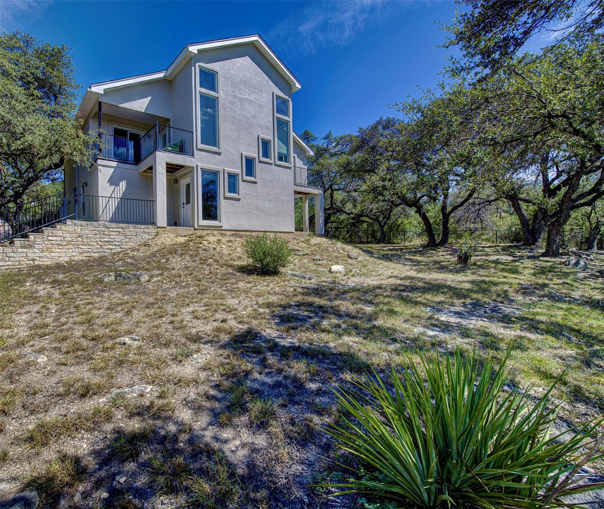 View 13821 Hunters Pass in APACHE SHORES 13821 Hunters Pass - front exterior - Luxury home in APACHE SHORES, Austin, TX