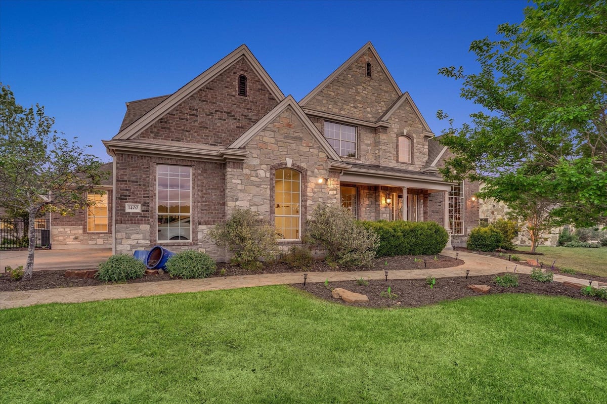 View 1400 Tom Sawyer Rd in Sawyer Ranch Sec 5 1400 Tom Sawyer Rd - front exterior - Luxury home in Sawyer Ranch Sec 5, Dripping Springs, TX