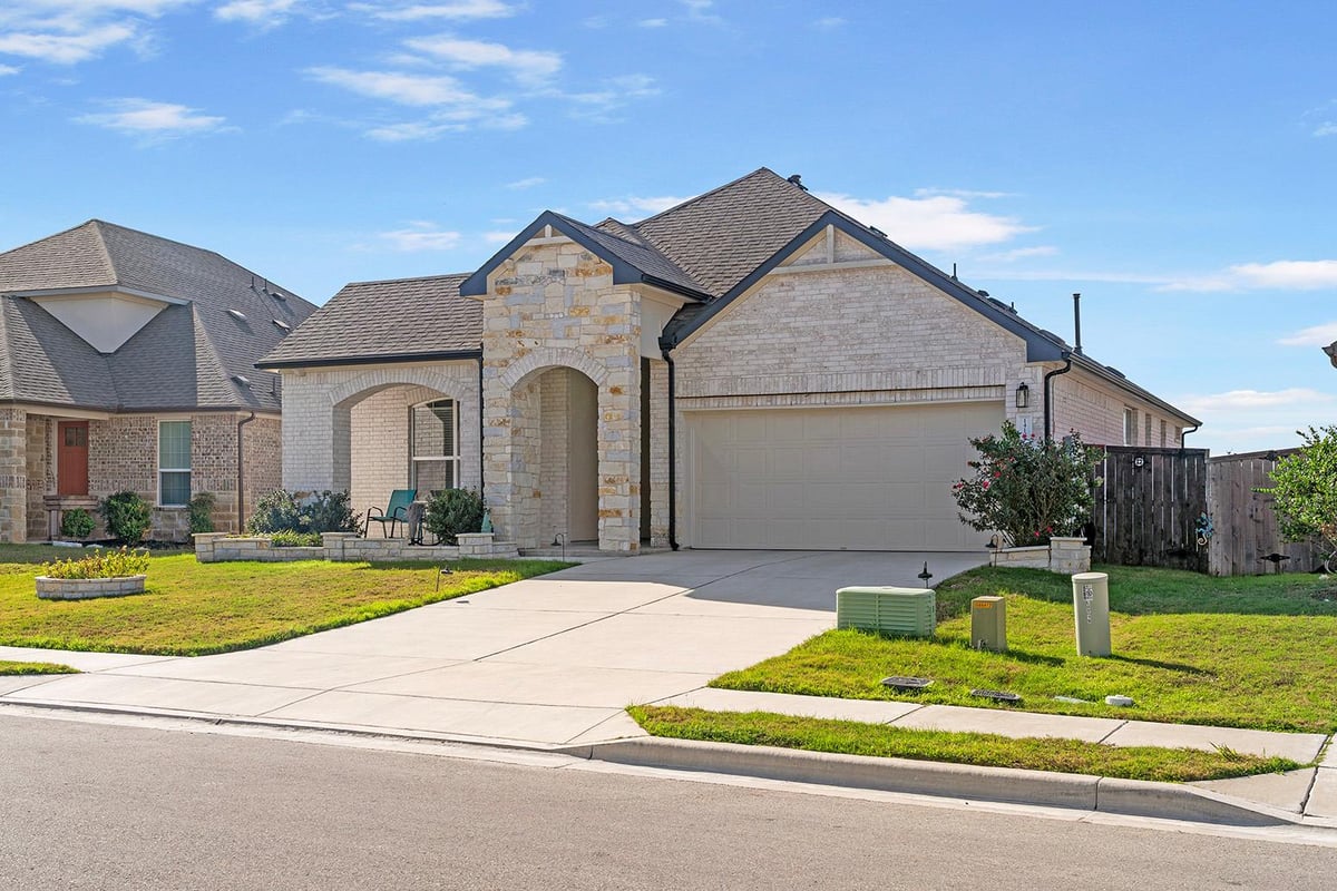 View 14108 Sage Blossom DR in SHADOWGLEN 14108 Sage Blossom DR - front exterior - Luxury home in SHADOWGLEN, Manor, TX