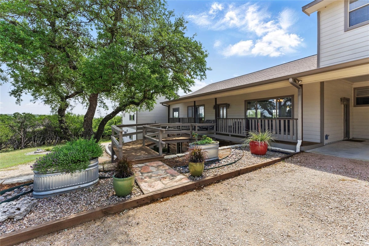 View 14415 Evergreen Cv in Whispering Oaks 14415 Evergreen Cv - front exterior - Luxury home in Whispering Oaks, Austin, TX