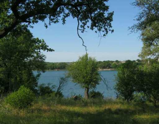 View 15 Travis Oaks DR 15 Travis Oaks DR - front exterior - Luxury lot in Marble Falls, TX