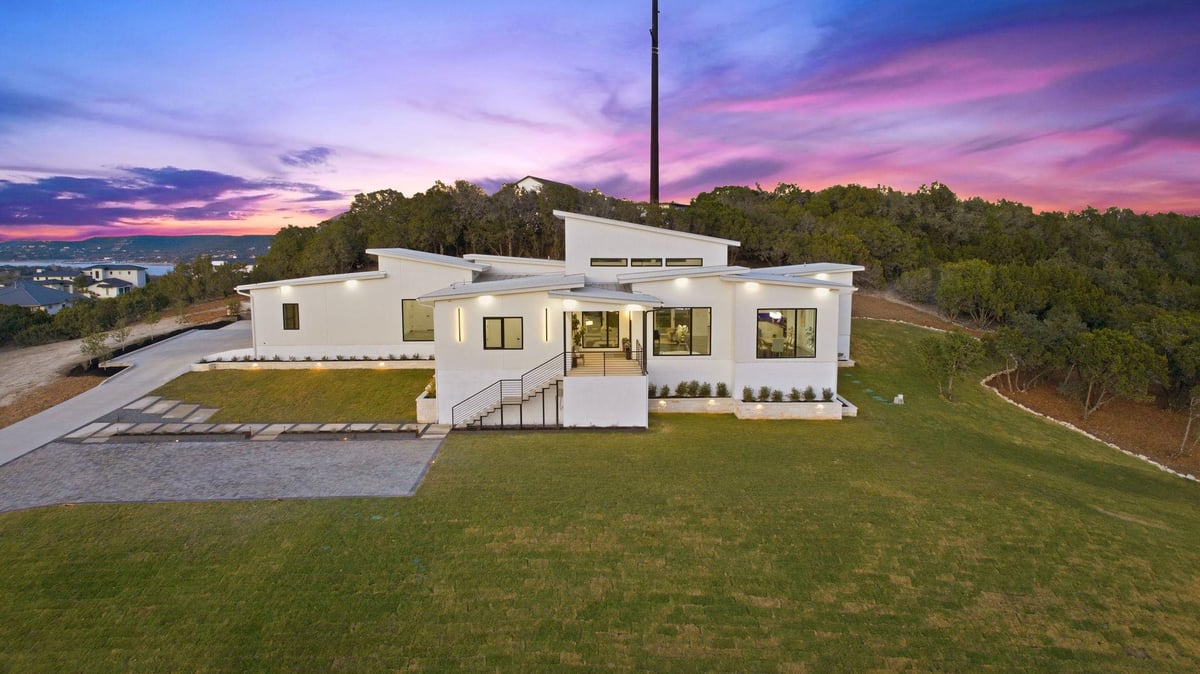 View 15400 Watumba Rd in McCormick Mountain Estates 15400 Watumba Rd - aerial view with twilight Hill Country residence - Luxury home in McCormick Mountain Estates, Austin, TX