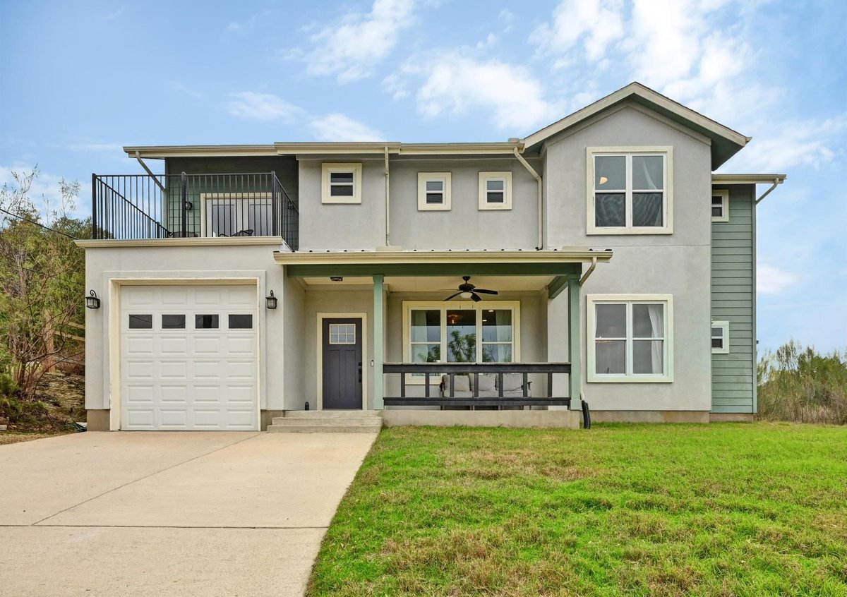 View 17305 Lake Wood Cir in Mountain Creek Lakes Sec 01 17305 Lake Wood Cir - front exterior - Luxury home in Mountain Creek Lakes Sec 01, Dripping Springs, TX