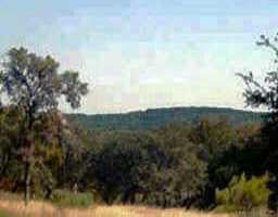View 18005 Hideaway Cv 18005 Hideaway Cv - front exterior - Luxury lot in Dripping Springs, TX