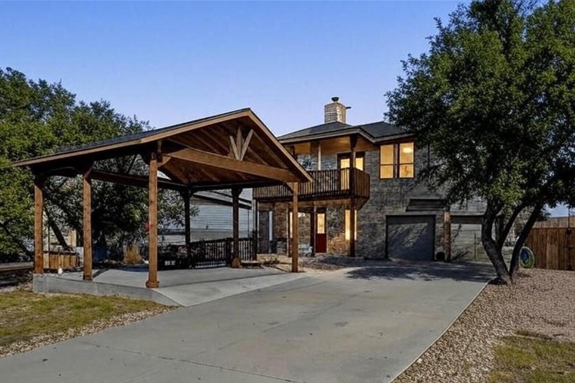 View 19004 Mariners Pt in Point Venture Sec 03-1 19004 Mariners Pt - front exterior - Luxury home in Point Venture Sec 03-1, Lago Vista, TX