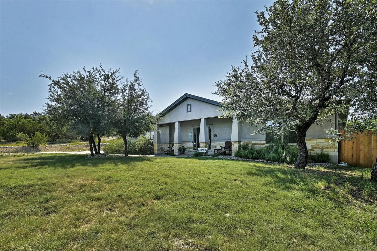 View 19908 Victoria Chase Rd in Porticos 19908 Victoria Chase Rd - front exterior - Luxury home in Porticos, Lago Vista, TX