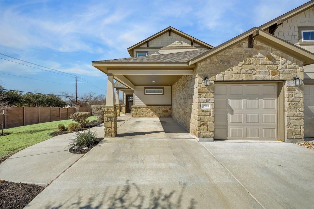 View 20500 Tractor Dr Unit #A in VILLAS AT ROWE CONDOMINIUM 20500 Tractor Dr Unit #A - front exterior - Luxury home in VILLAS AT ROWE CONDOMINIUM, Pflugerville, TX