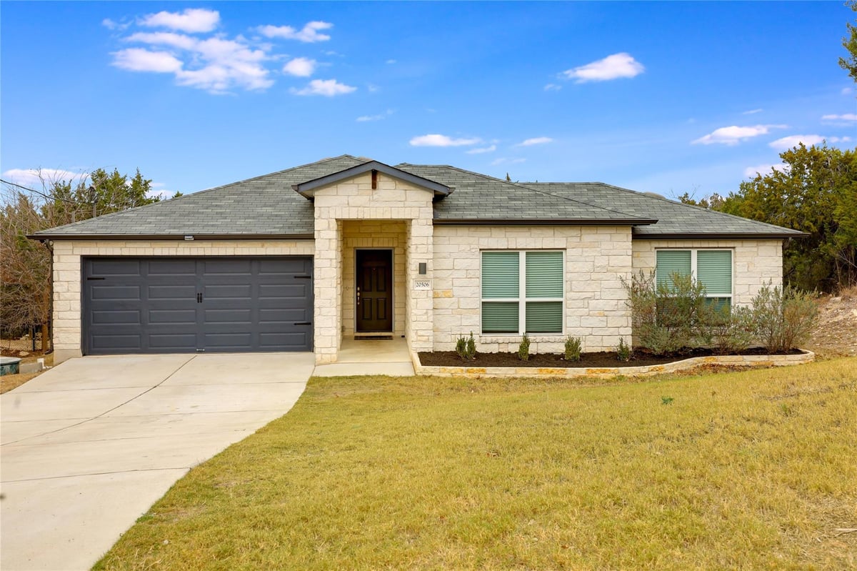 View 20506 National DR in Lago Vista Country Club Estate 20506 National DR - front exterior - Luxury home in Lago Vista Country Club Estate, Lago Vista, TX