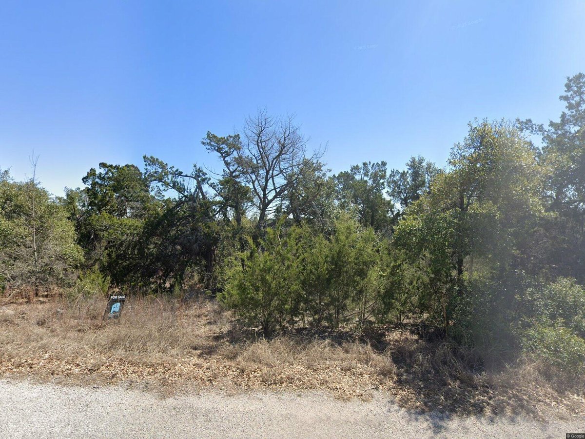 View 21121 Bison Trl in Bar-K Ranches 13 21121 Bison Trl - front exterior - Luxury lot in Bar-K Ranches 13, Lago Vista, TX