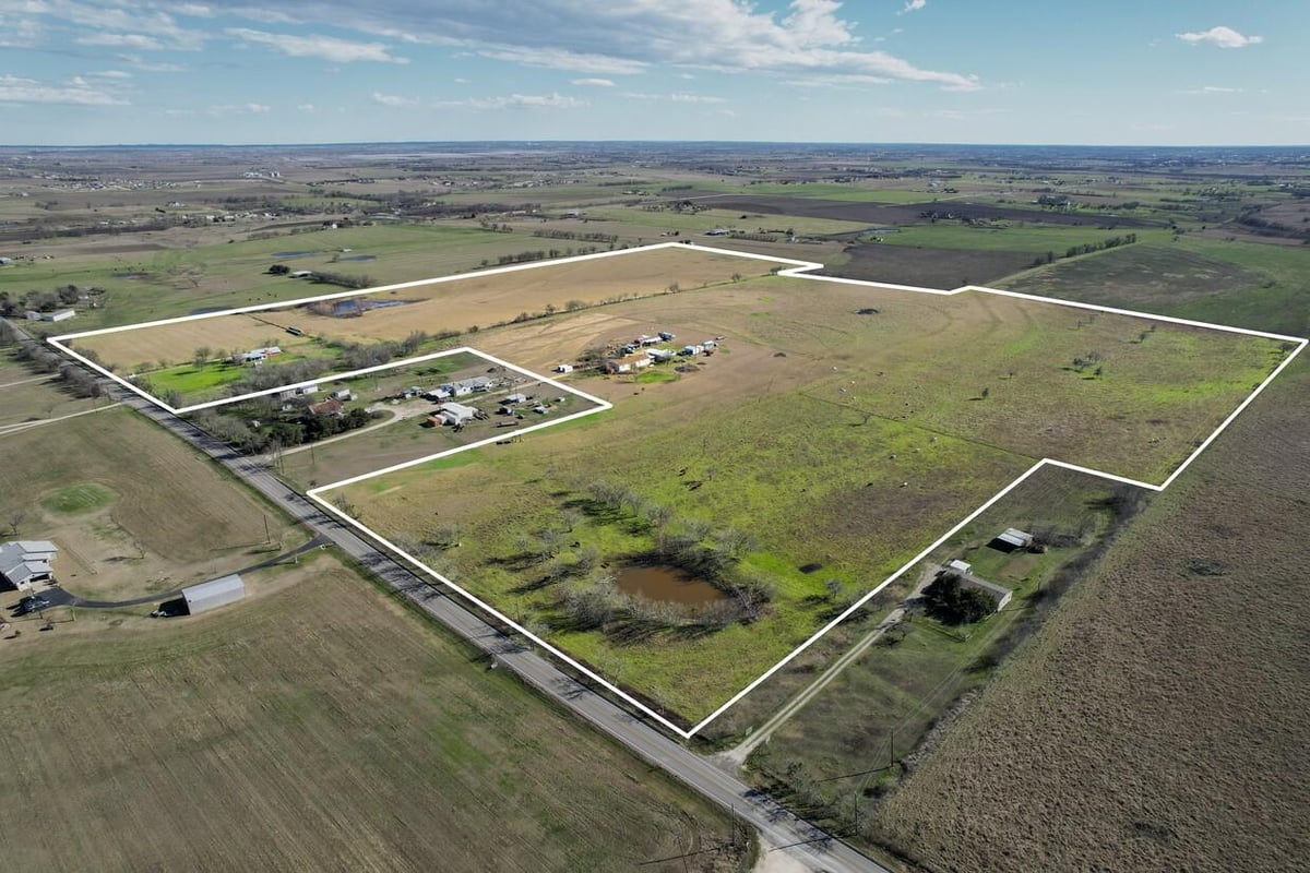 View 21265 Melber Ln in Samuel C Jones 21265 Melber Ln - aerial view with outlined Manor-area land tract - Luxury home in Samuel C Jones, Manor, TX