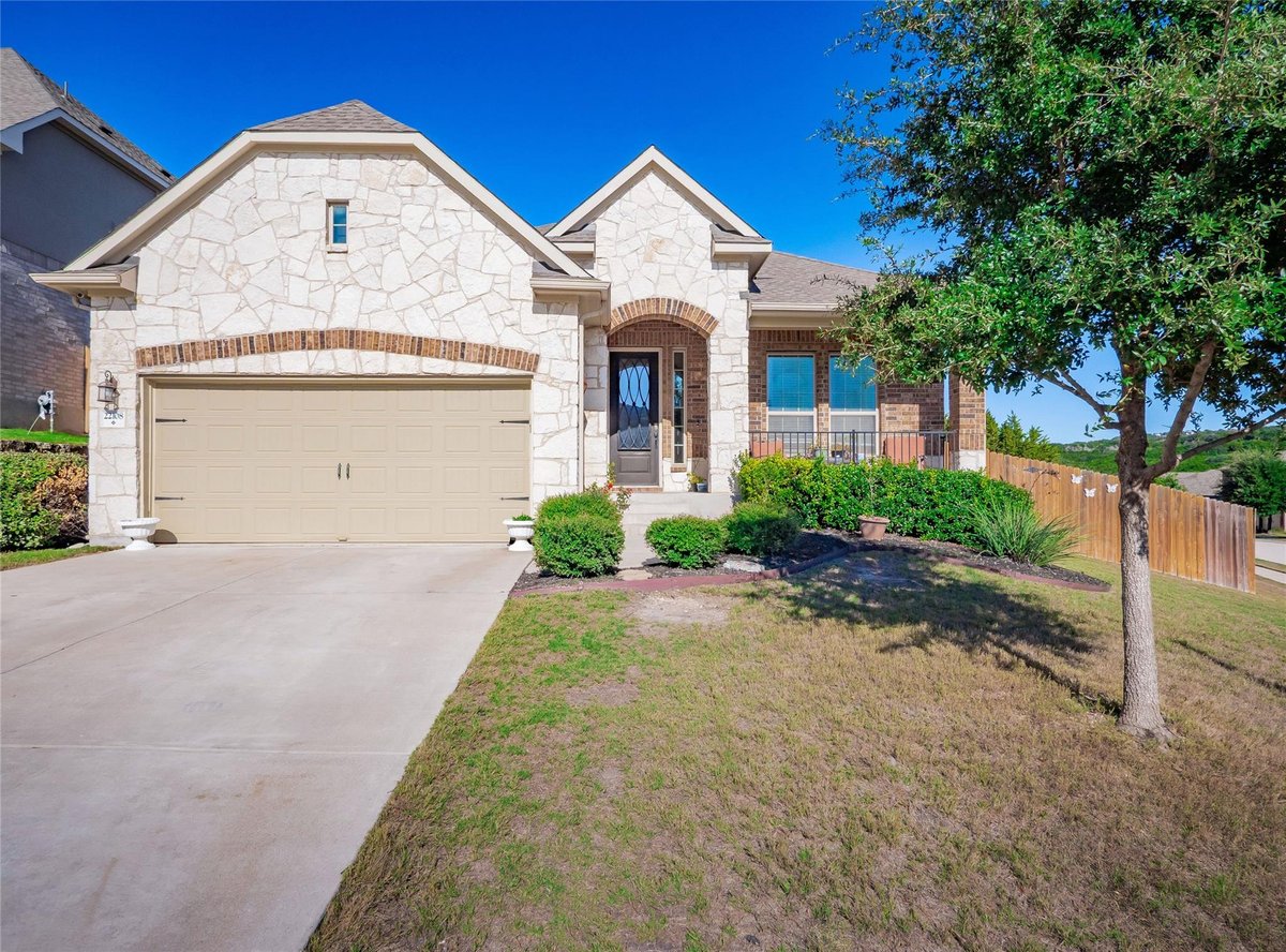 View 22108 Cross Timbers BND in Tessera On Lake Travis Ph 1A 22108 Cross Timbers BND - front exterior - Luxury home in Tessera On Lake Travis Ph 1A, Lago Vista, TX