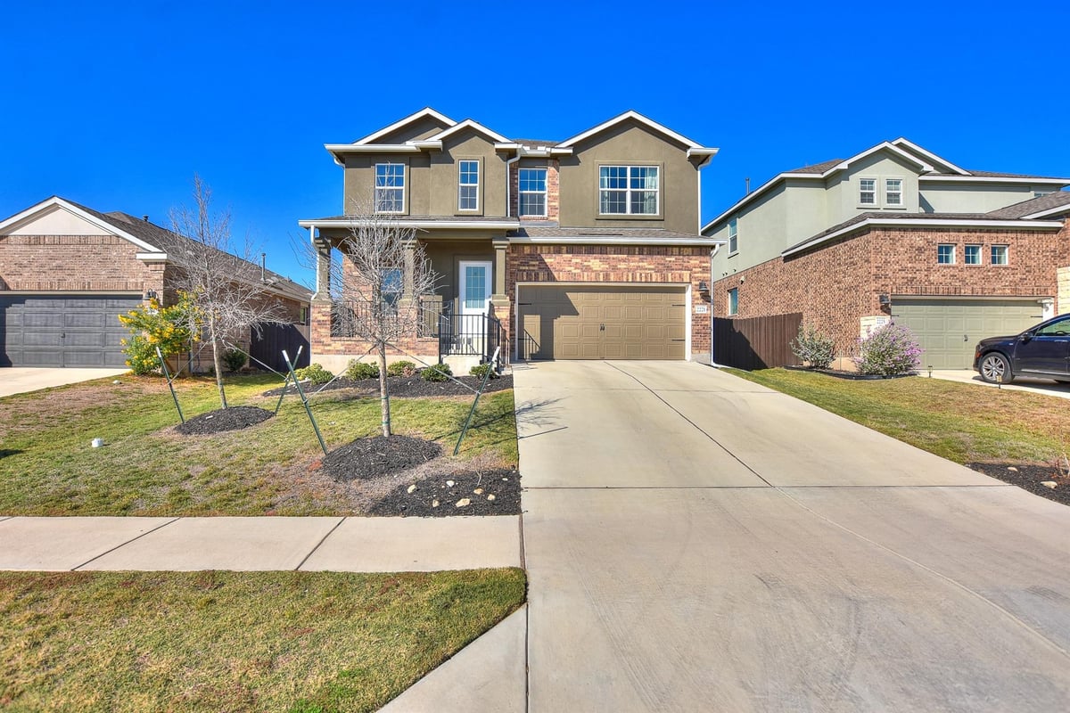 View 2221 Four Waters Loop in Lively Ranch 2221 Four Waters Loop - front exterior - Luxury home in Lively Ranch, Georgetown, TX