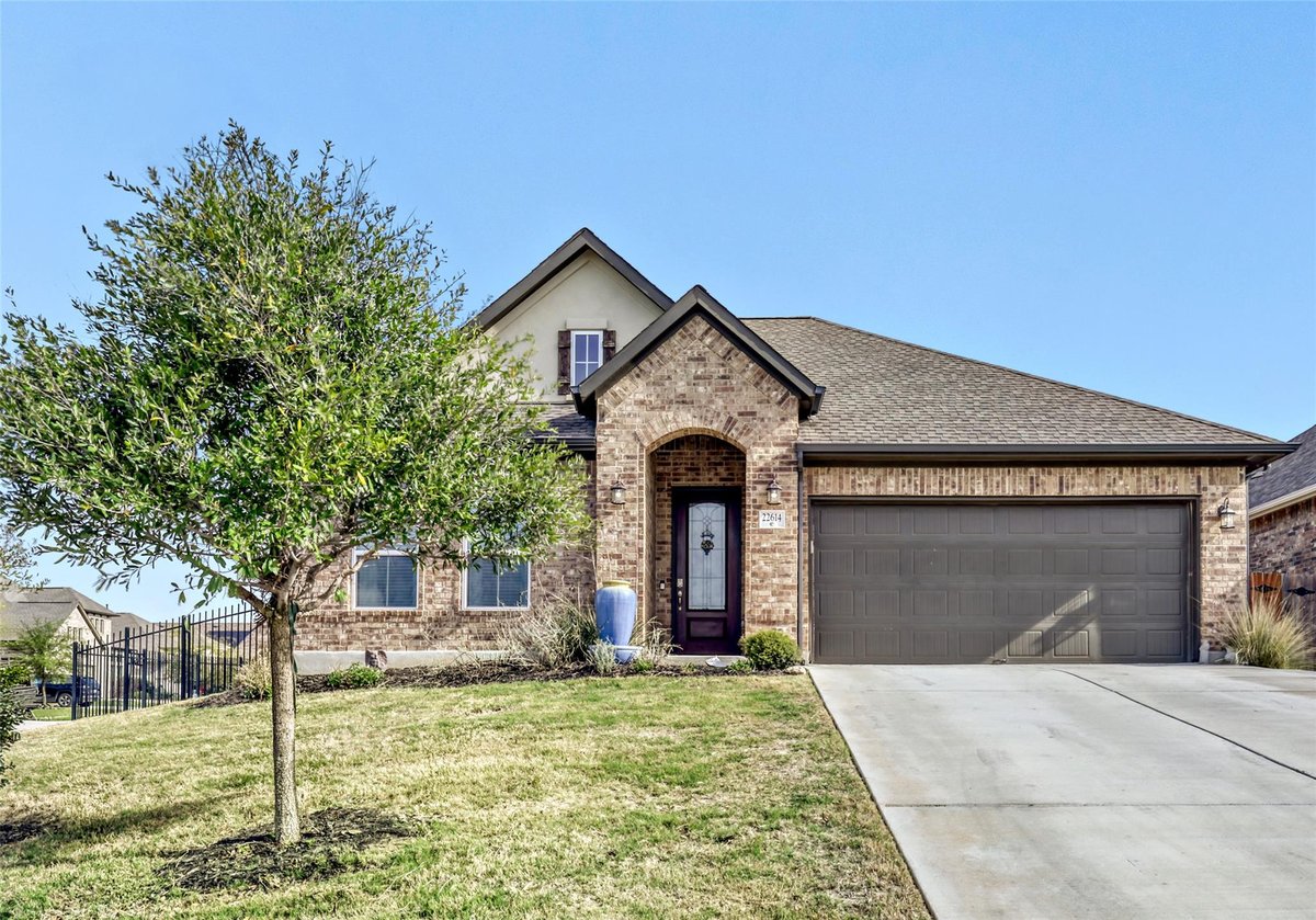 View 22614 Maidengrass Lane in Lakeside At Tessera 22614 Maidengrass Lane - front exterior - Luxury home in Lakeside At Tessera, Lago Vista, TX
