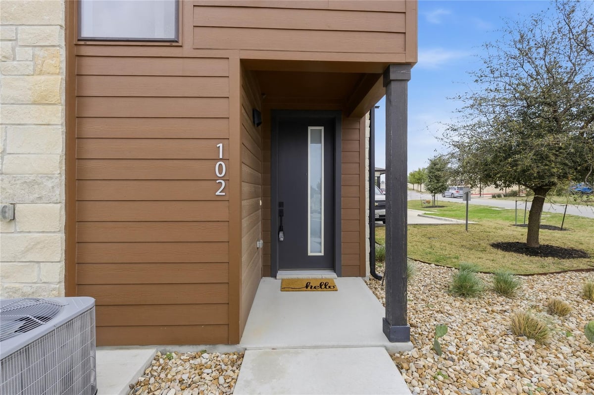 View 315 Holton Dr Unit #102 in Hudson At Belterra Condo 315 Holton Dr Unit #102 - front exterior - Luxury home in Hudson At Belterra Condo, Austin, TX
