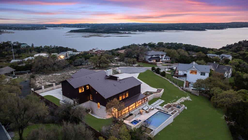 View 4001 Tejon CIR in Vista Grande Sec 02 4001 Tejon CIR - aerial view with Lake Travis sunset view and pool terrace - Luxury home in Vista Grande Sec 02, Austin, TX