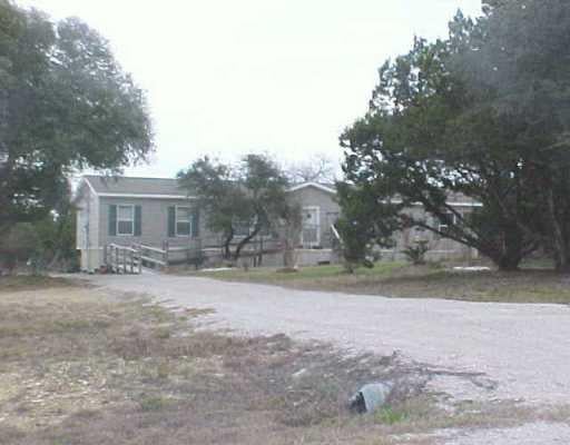 View 651 Rolling Block DR 651 Rolling Block DR - front exterior - Luxury lot in Liberty Hill, TX