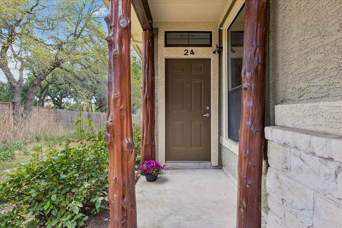 View 6705 Covered Bridge DR Unit #24 in Gardens At Covered Bridge Condo 6705 Covered Bridge DR Unit #24 - front exterior - Luxury home in Gardens At Covered Bridge Condo, Austin, TX