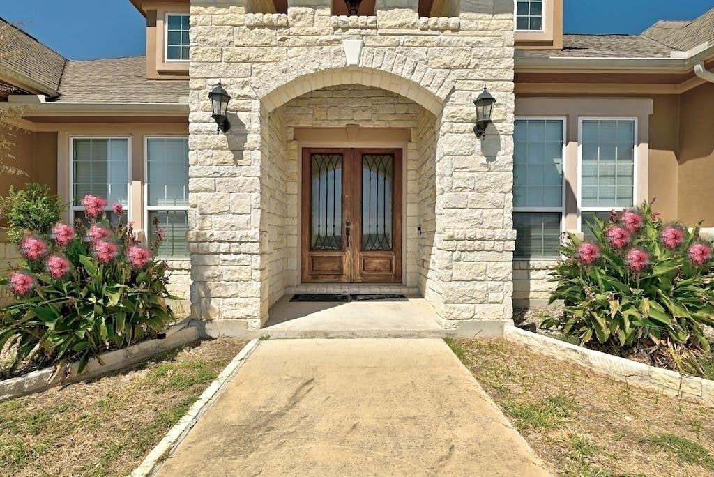 View 7300 Gilbert Rd in Buckman 7300 Gilbert Rd - front exterior with 7300 Gilbert Rd in Manor - Luxury home in Buckman, Manor, TX