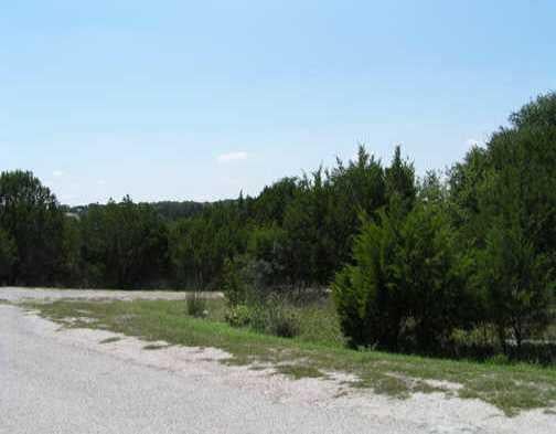 View 7704 Dogie CV 7704 Dogie CV - front exterior - Luxury lot in Lago Vista, TX