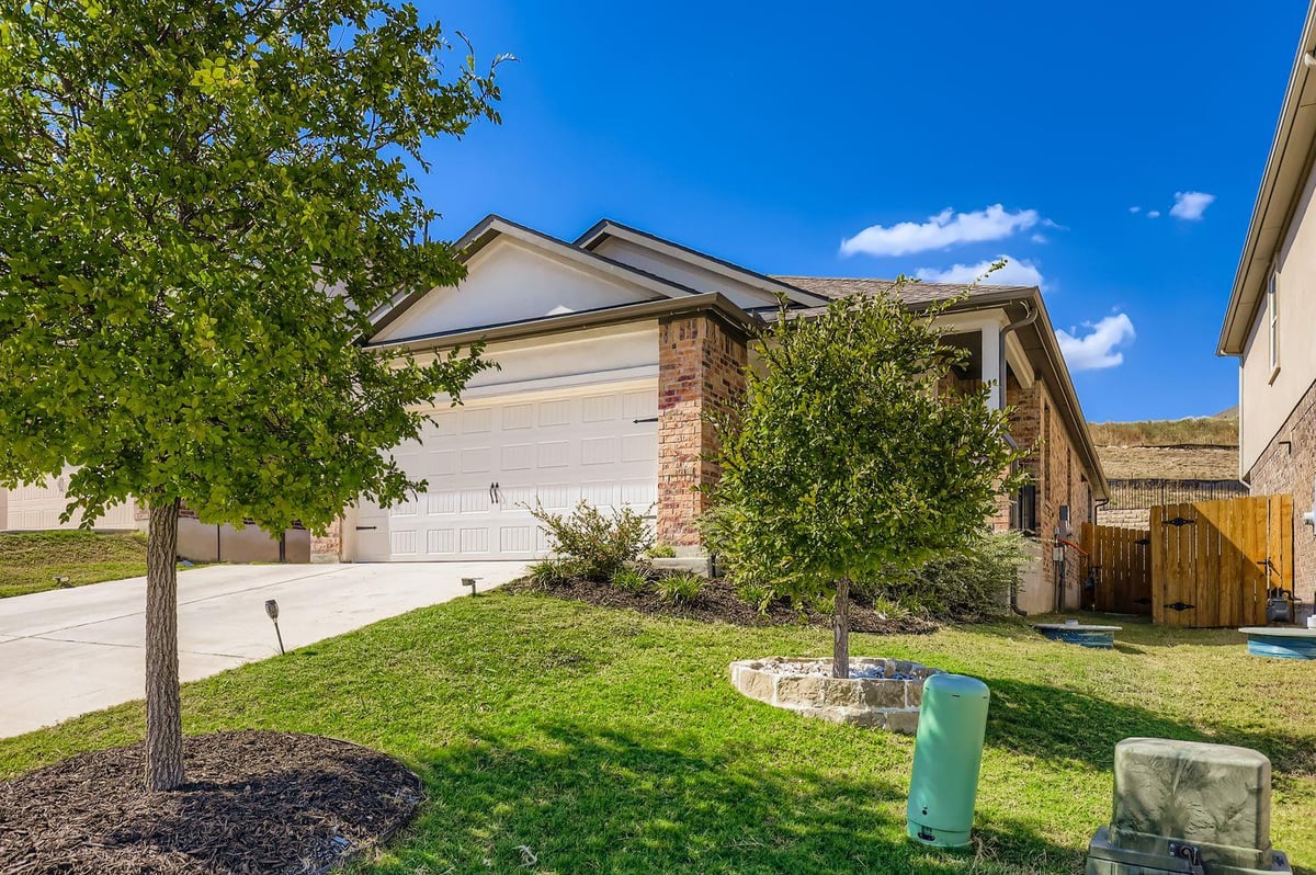 View 8212 Purple Aster Pass in TESSERA ON LAKE TRAVIS 8212 Purple Aster Pass - front exterior - Luxury home in TESSERA ON LAKE TRAVIS, Lago Vista, TX