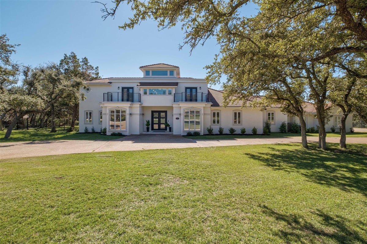 View 8801 Young Ln in Estates of Lewis Mountain 8801 Young Ln - front exterior - Luxury home in Estates of Lewis Mountain, Austin, TX