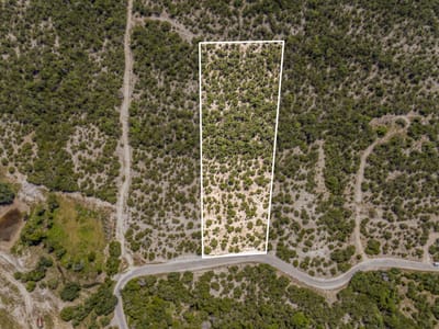 Primary bedroom at 10686 Deer Canyon Rd - PANORAMIC HILLS, Jonestown, TX
