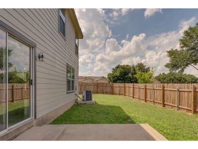 Primary bedroom at 401  Blanco Woods Blvd - 3 bed 2 bath home