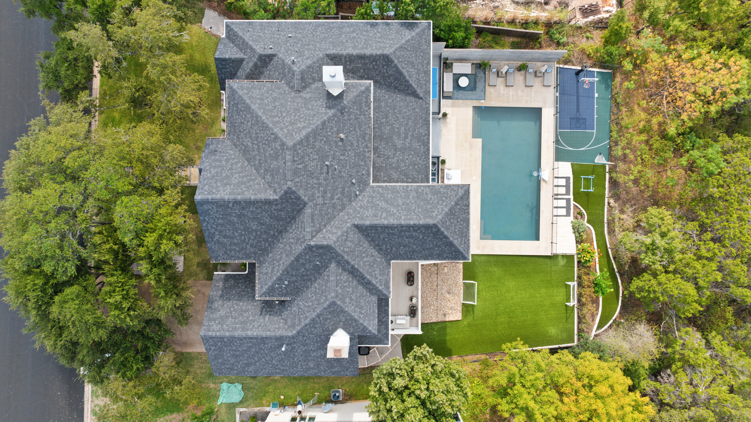 Luxury Austin home exterior with professional landscaping and curb appeal