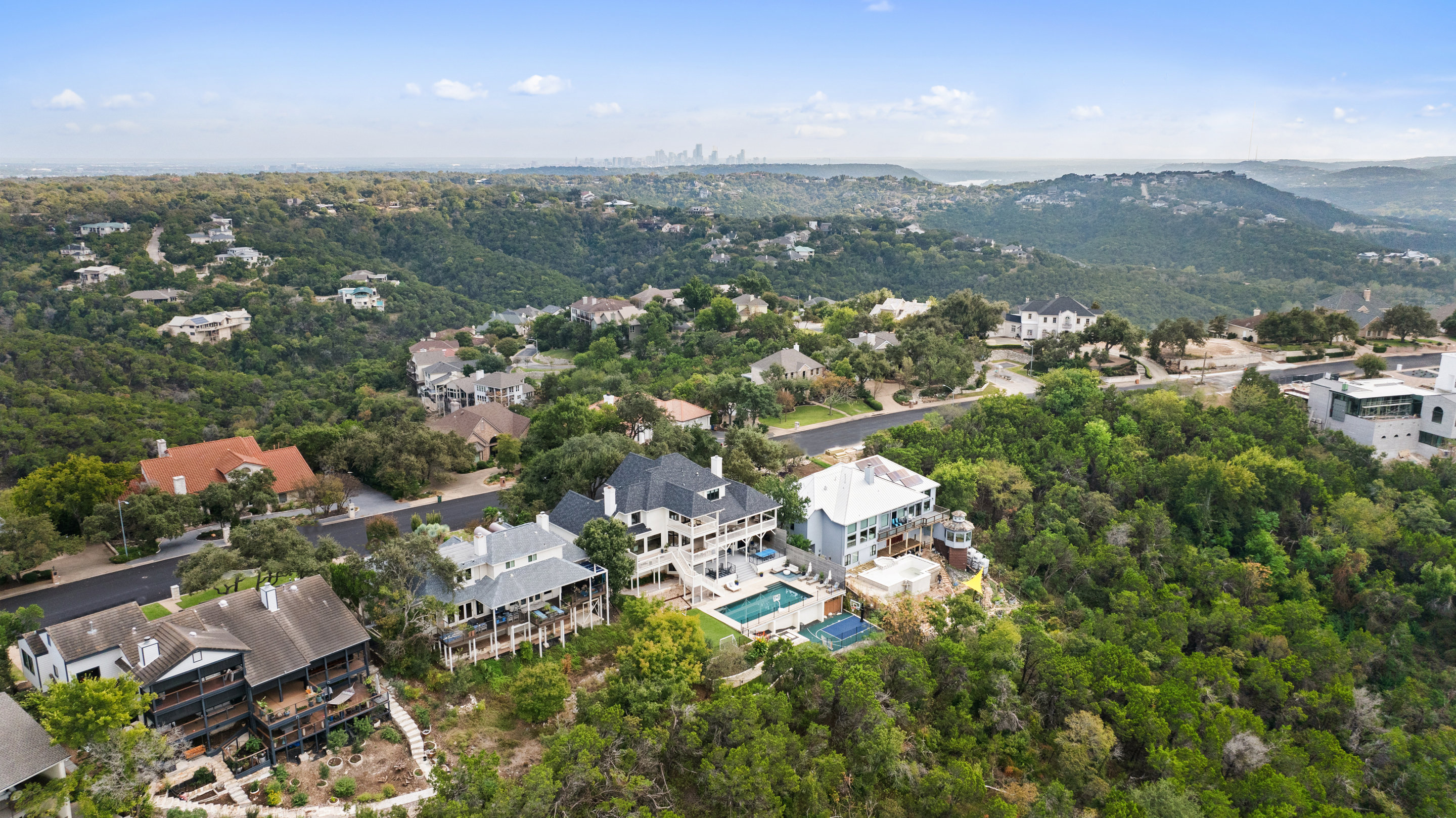 Austin luxury home with pool, sport court, and Hill Country setting