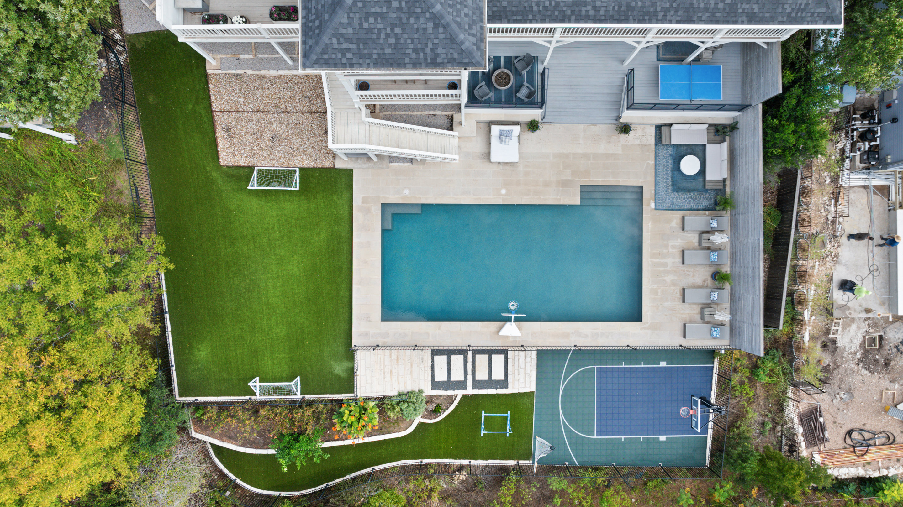 Austin luxury neighborhood aerial showing Hill Country terrain and canopy