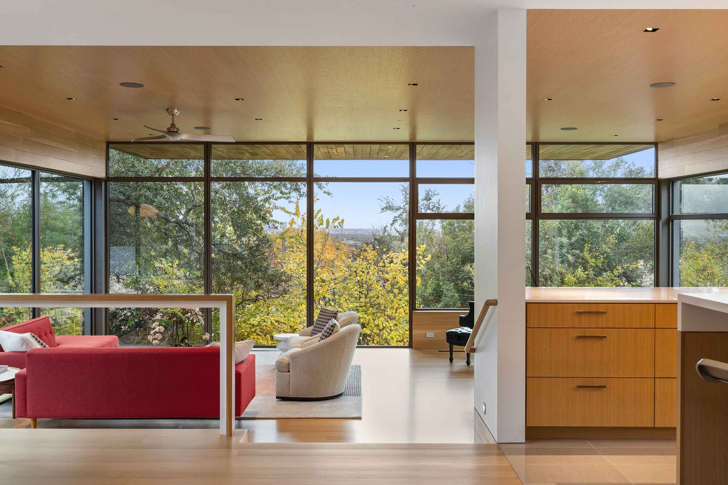 Entry approach through concrete walls and native landscaping