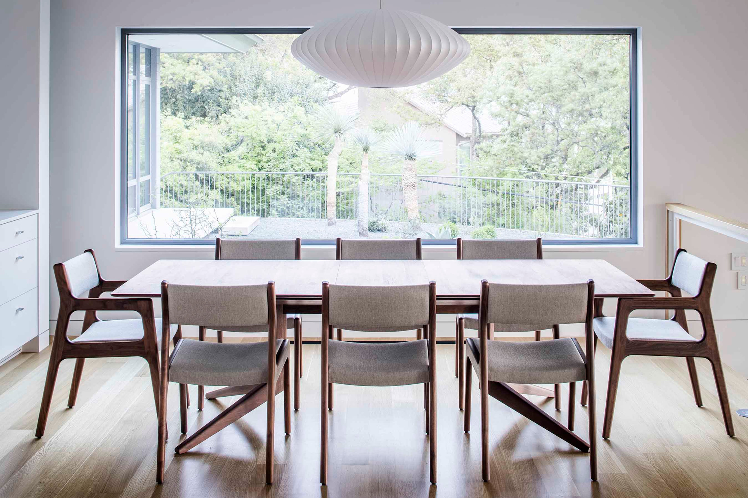 Open kitchen with Sub-Zero and Wolf appliances and marble surfaces