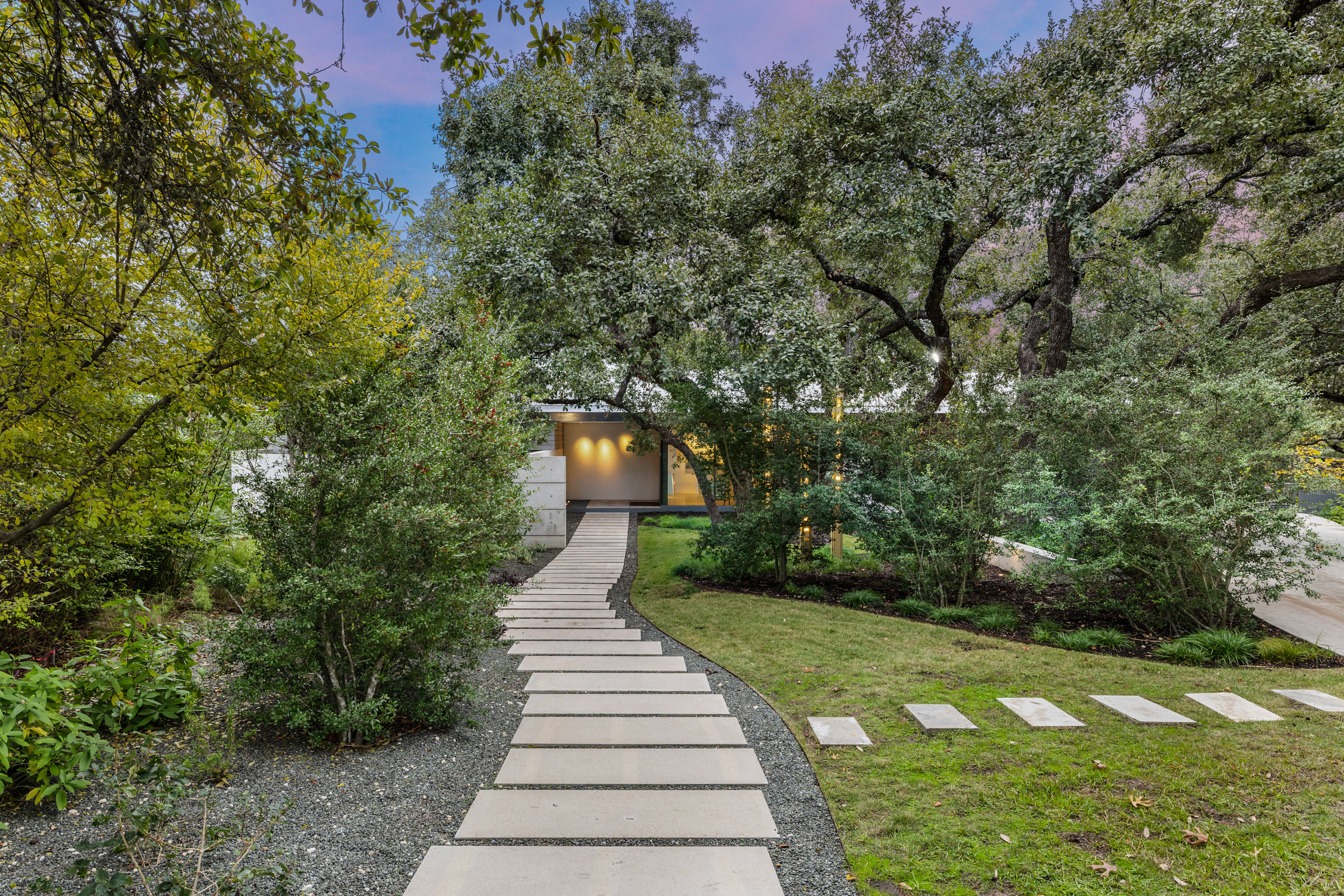 Landscaped approach with native grasses and limestone steps