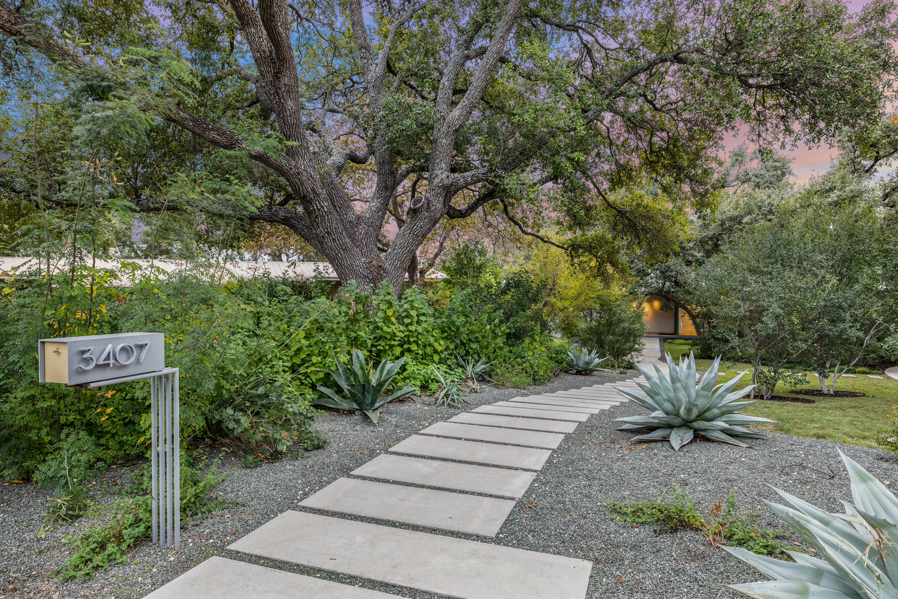 Rear elevation with glass walls opening to covered patio