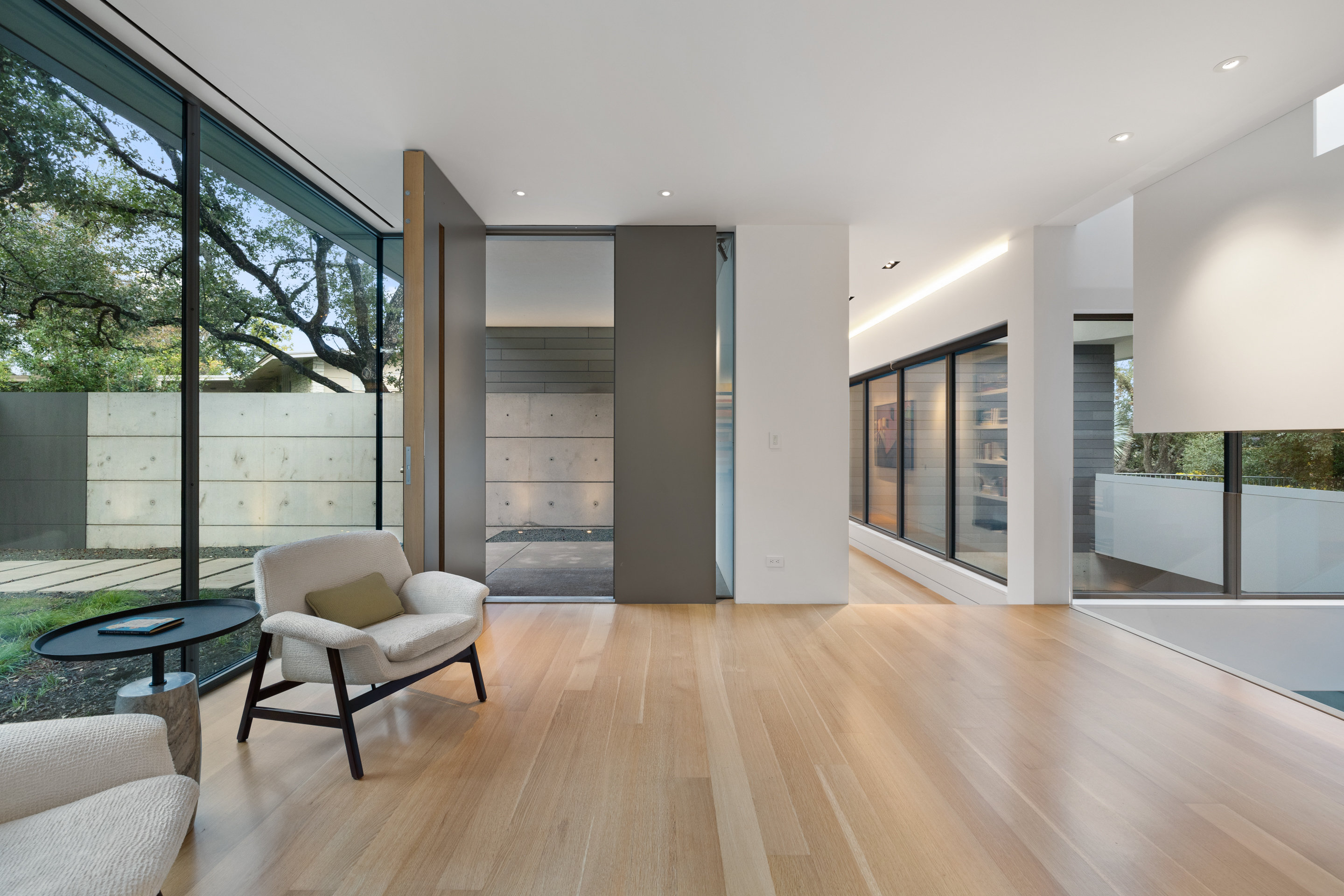 Stairwell detail showing glass wall to zen courtyard below