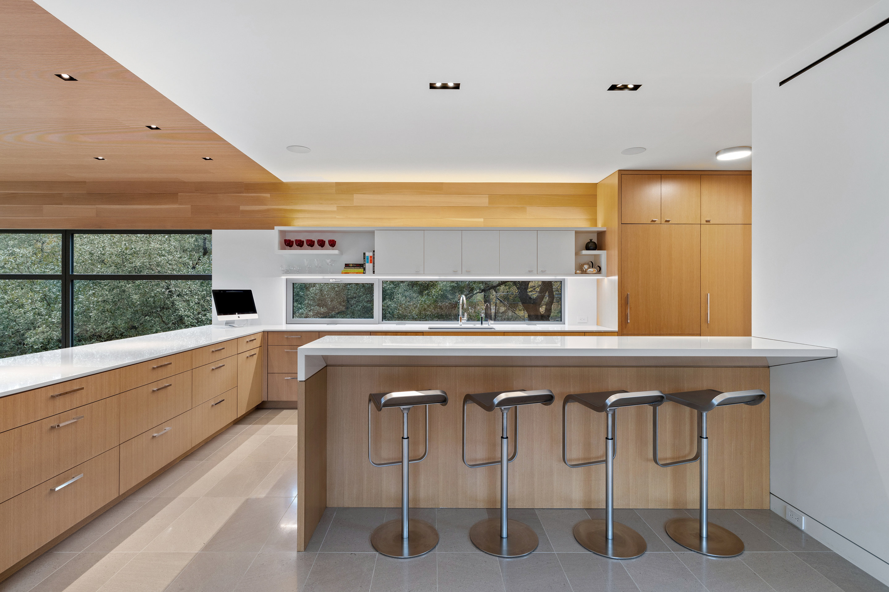 Kitchen workspace with concealed storage and induction cooktop