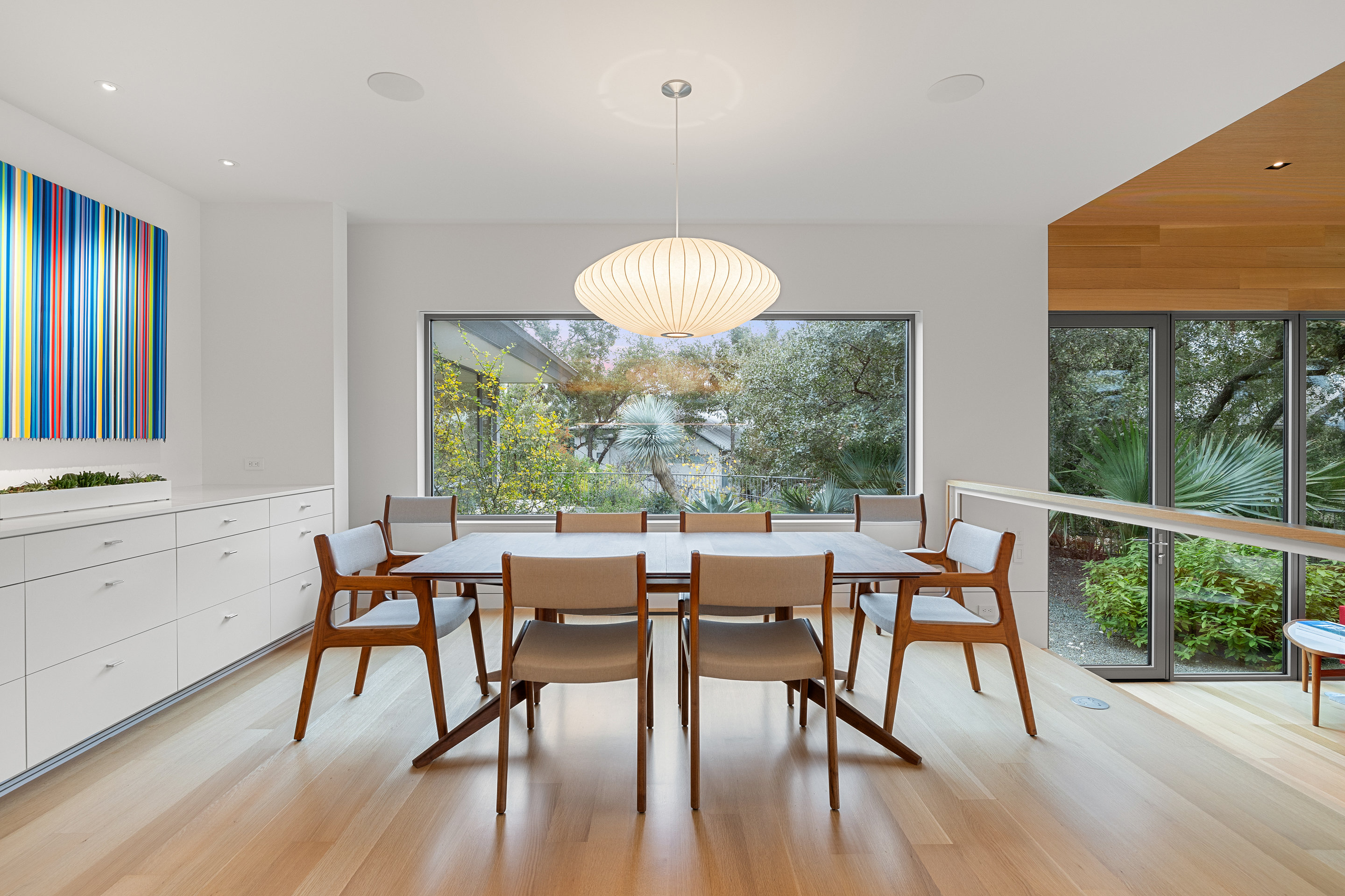 Primary closet with California closet system and natural light