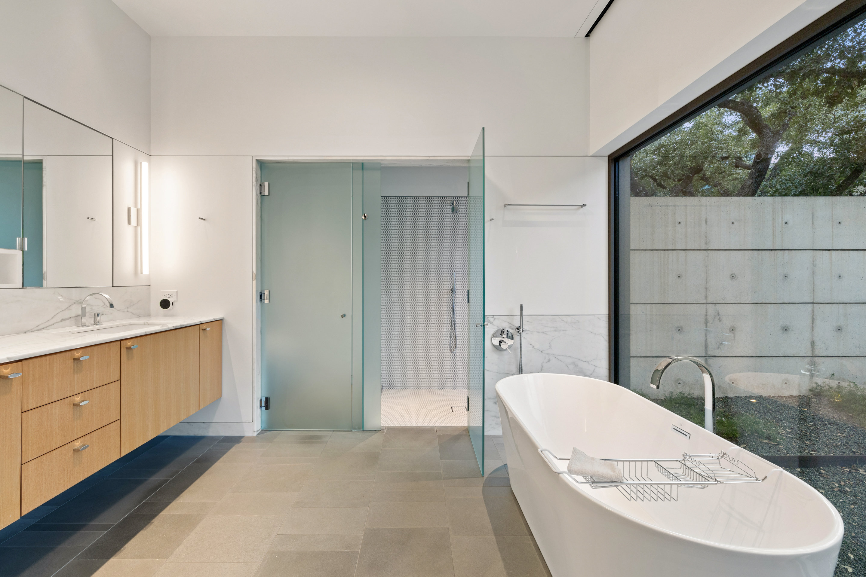 Third bedroom with courtyard-facing windows and built-in storage