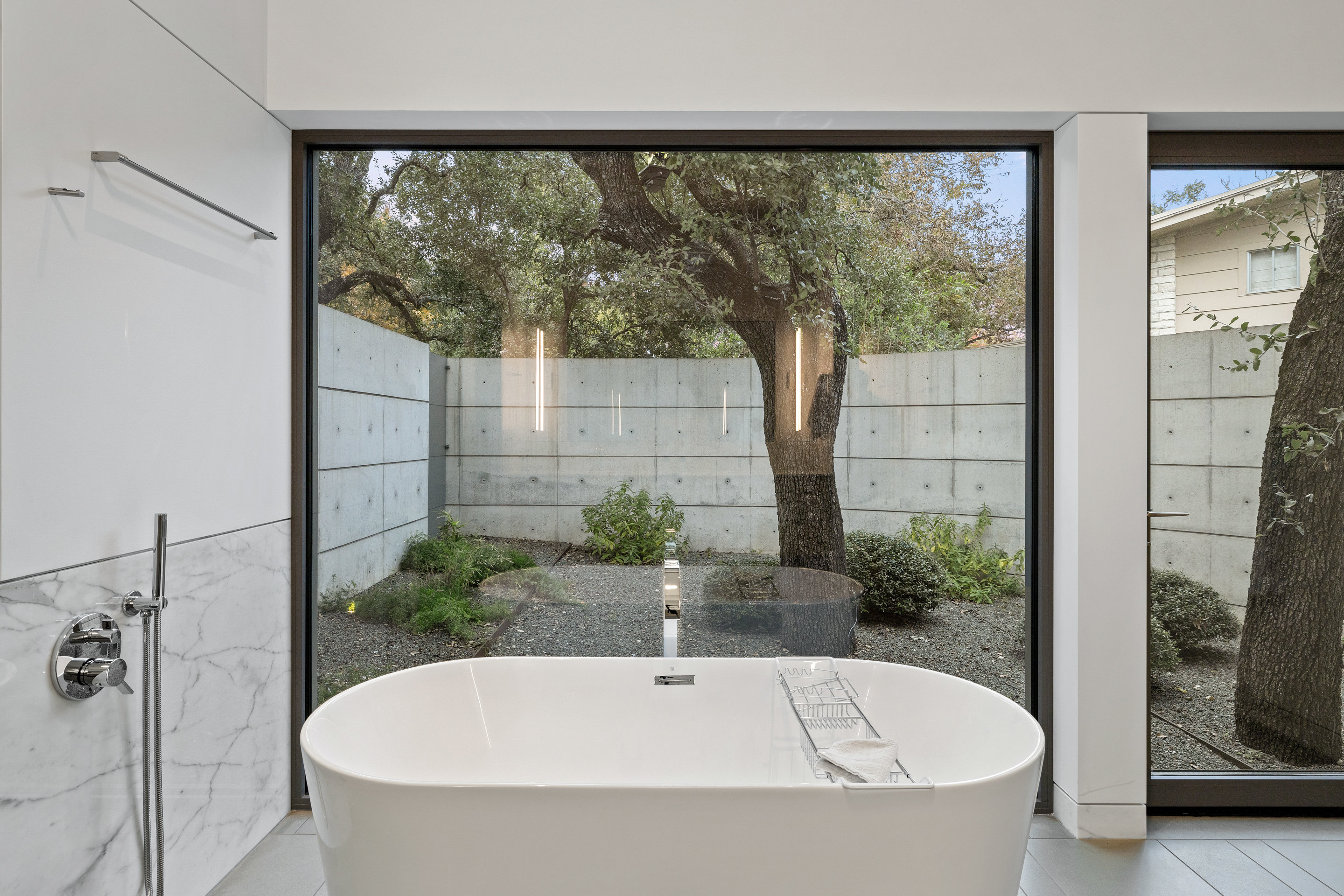 Lower-level media room with exposed concrete accents