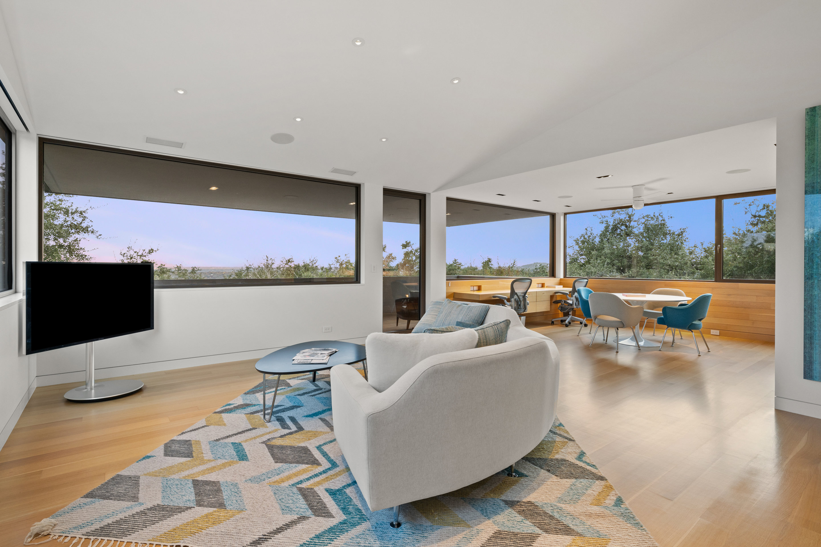 Upper level hallway with clerestory windows and white oak flooring