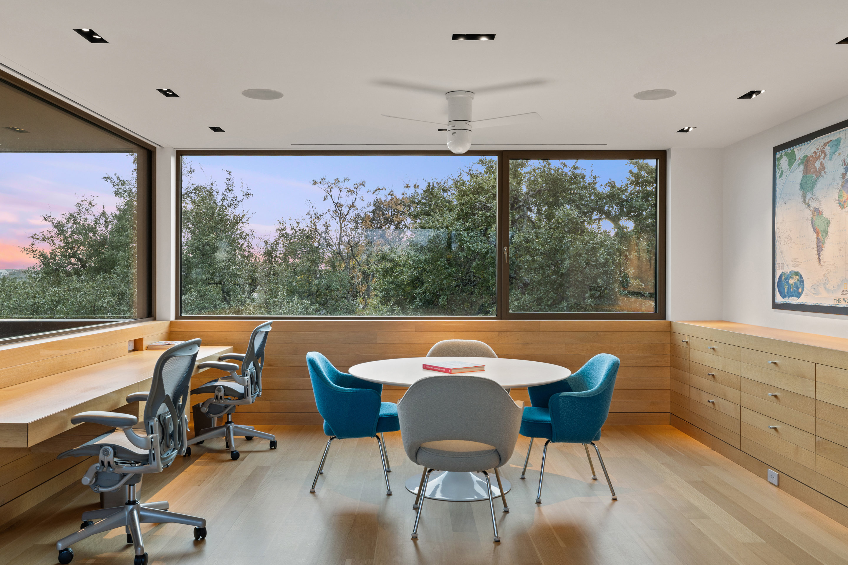 Custom steel and glass railing at stair landing