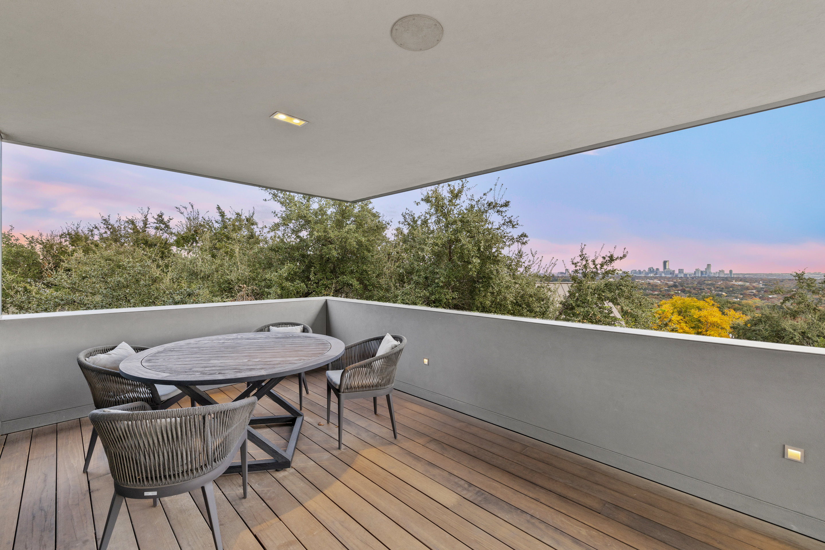 Game room with polished concrete floor and recessed lighting