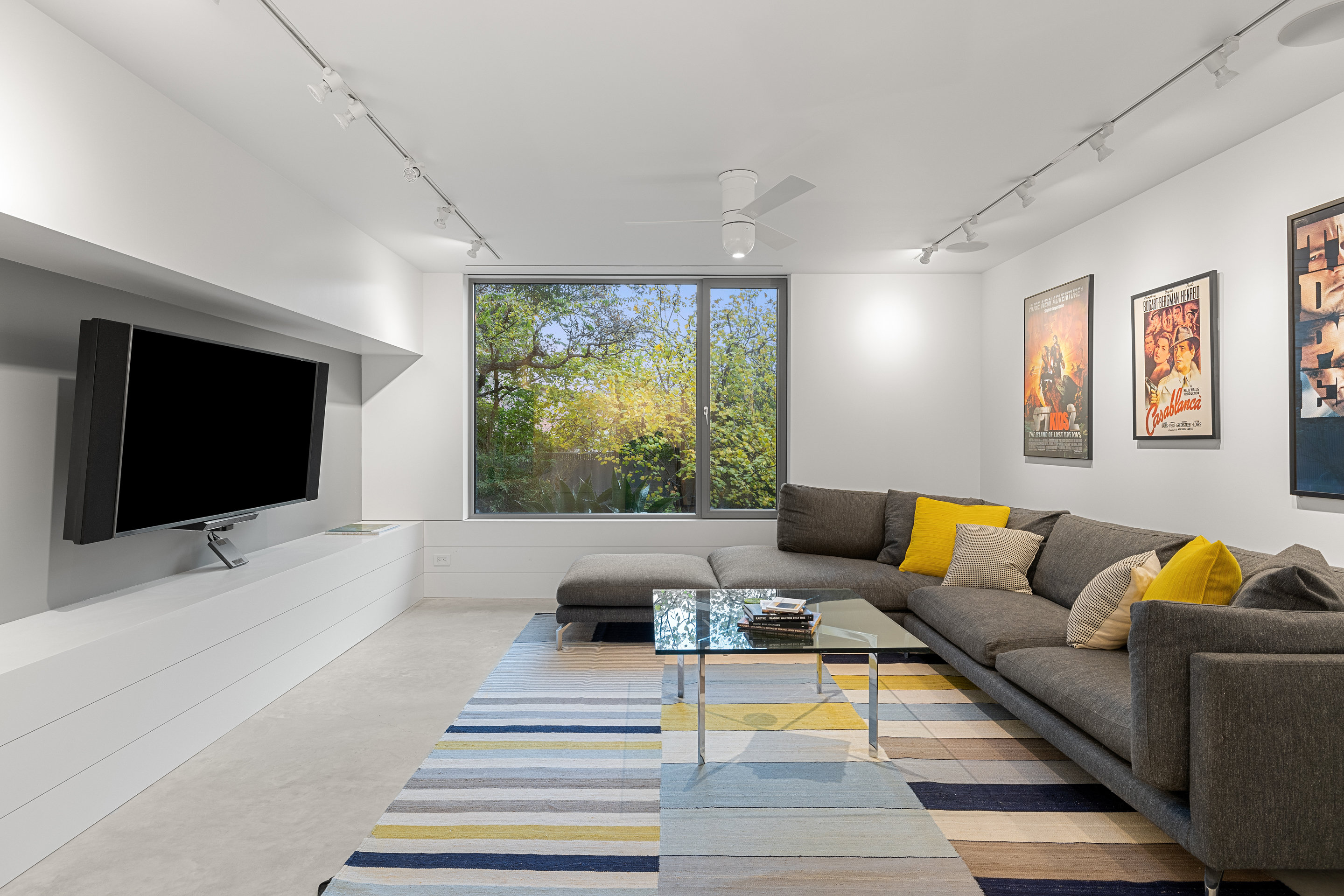 Exterior evening view showing interior glow through glass walls