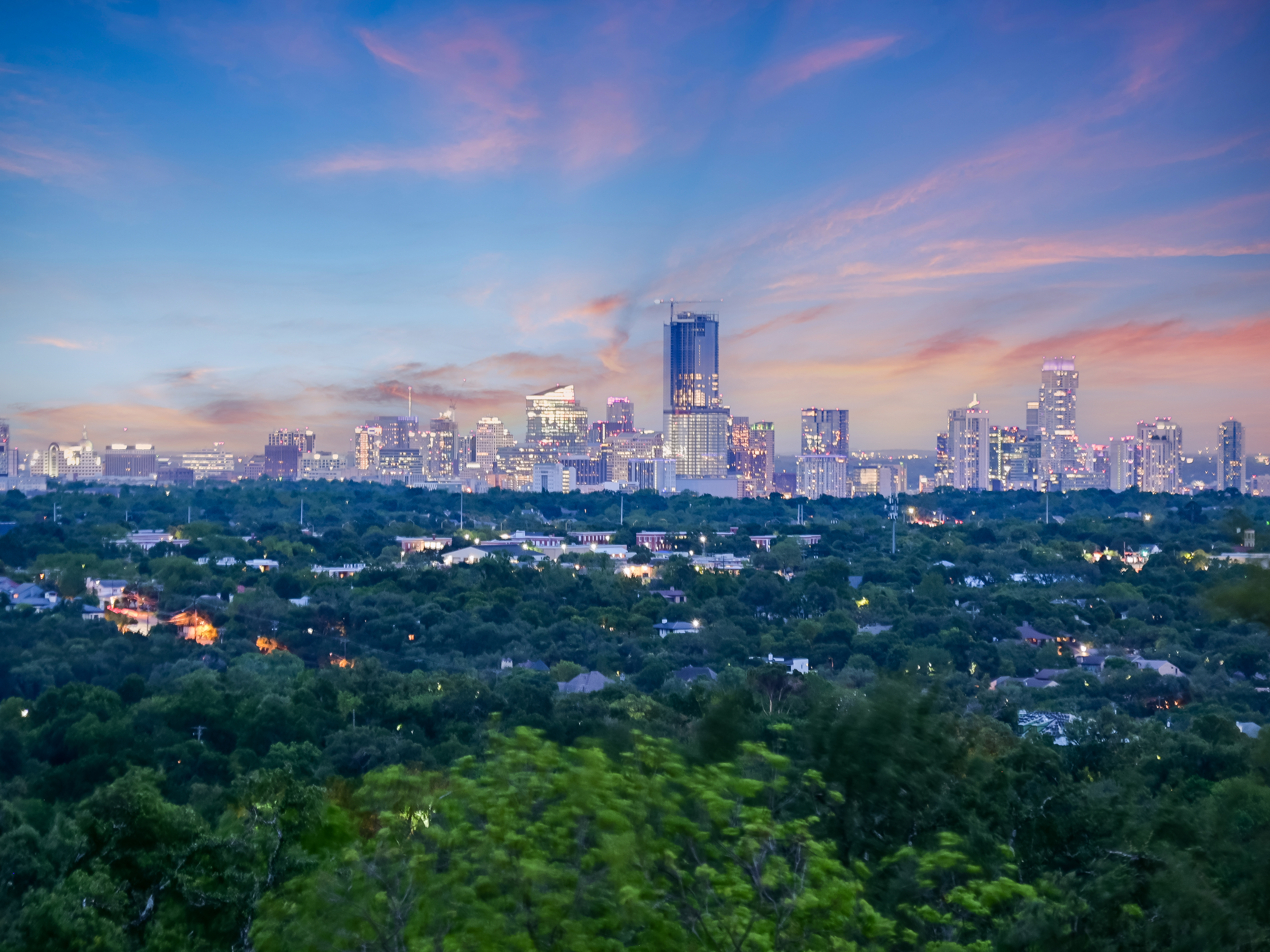 Downtown Austin skyline panorama with Hill Country backdrop at sunset